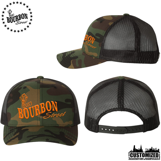 115th Bourbon Street - Embroidered Retro Trucker Hat - Camo With Orange Logo